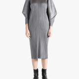 Grey dress worn by a person, showing the dress's fit