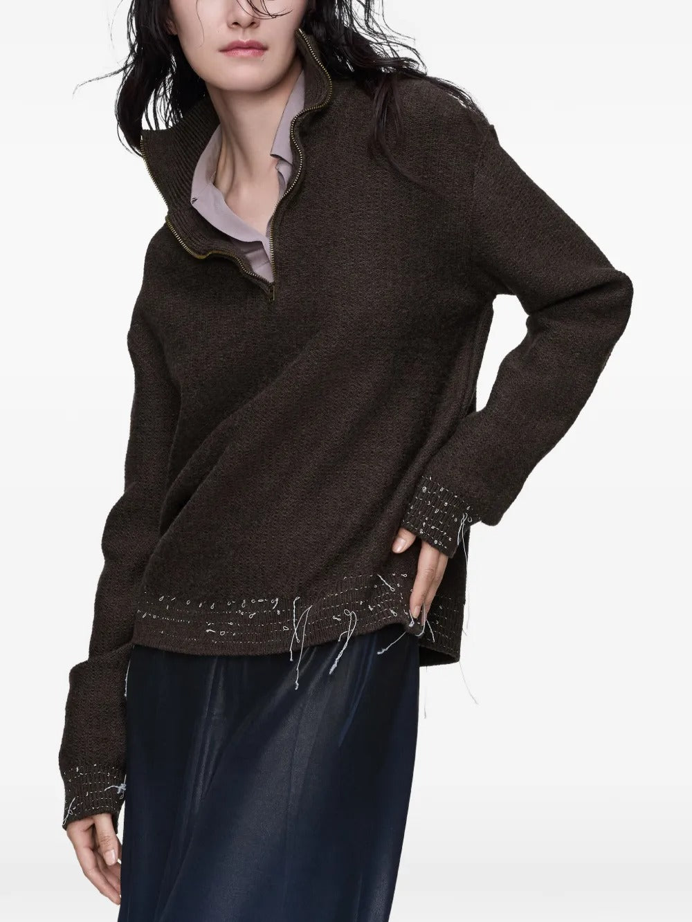 Brown tops worn by a person, showing the tops fit