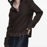 Brown tops worn by a person, showing the tops fit