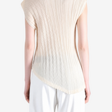 Tan shirt worn by a person, showing the shirt fit