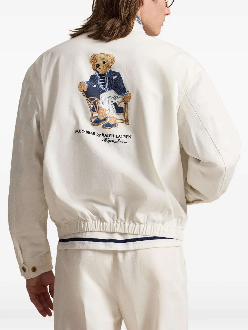 White coat worn by a person, showing the  coat's fit