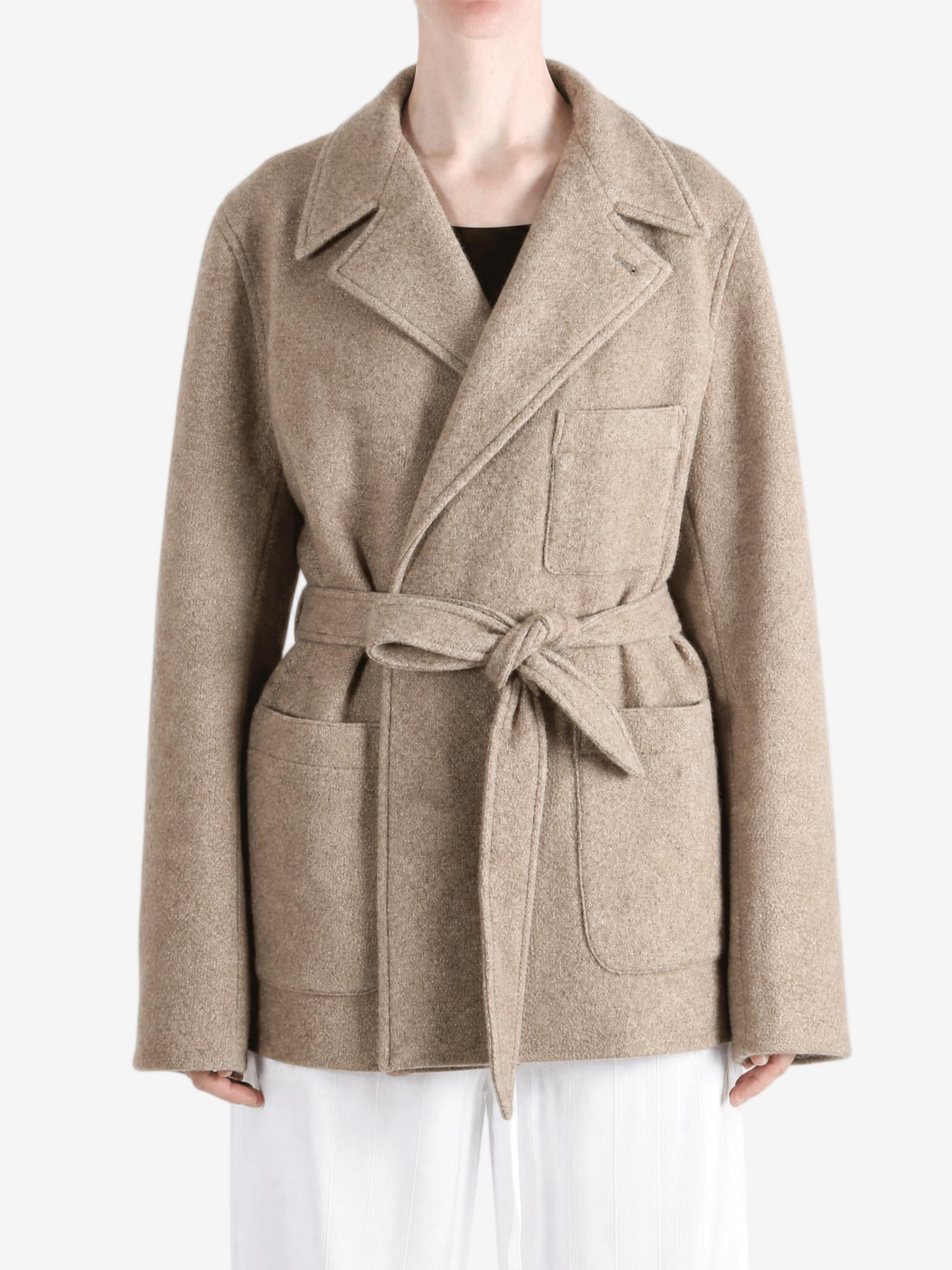 Tan jacket worn by a person, showing the jacket fit