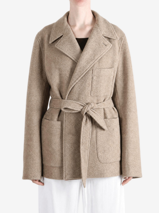 Tan jacket worn by a person, showing the jacket fit