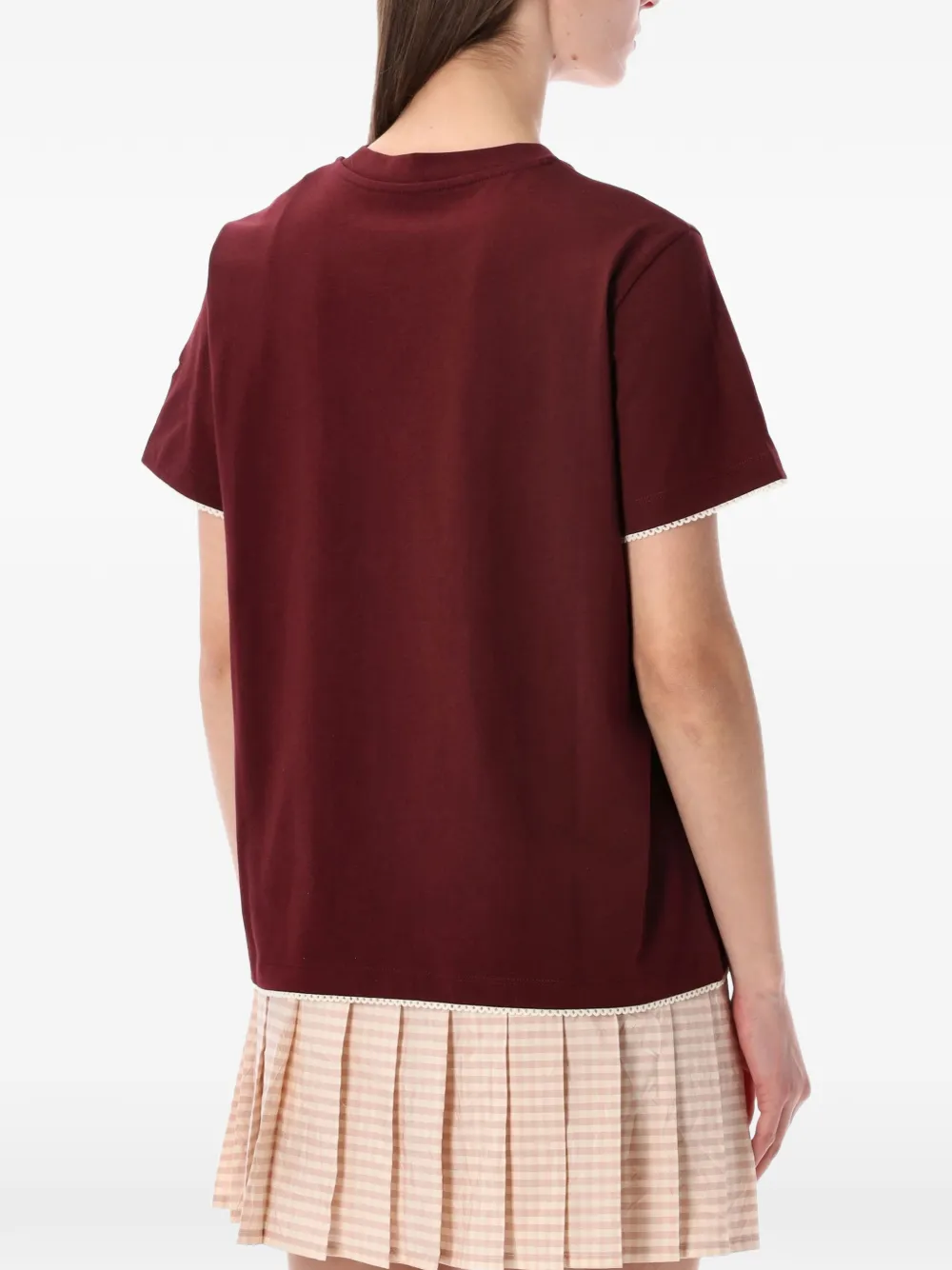 Red t-shirt  worn by a person, showing the t-shirt's fit