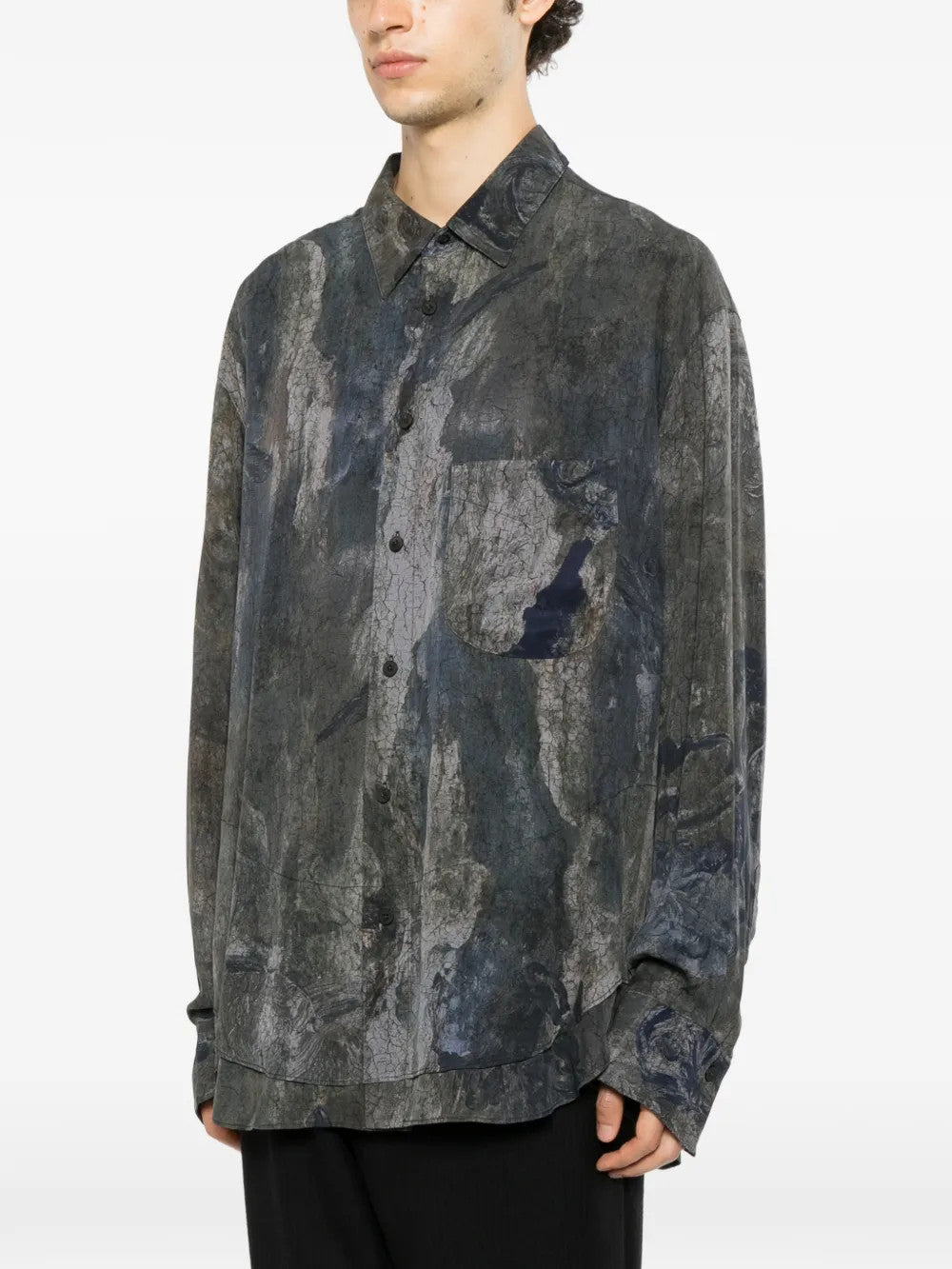 Grey shirt worn by a person, showing the shirt fit