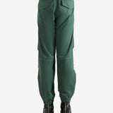 Green pants worn by a person, showing the pants's fit