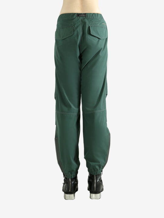 Green pants worn by a person, showing the pants's fit