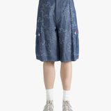 Blue shorts worn by a person, showing the shorts fit