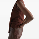 Brown top worn by a person, showing the top fit