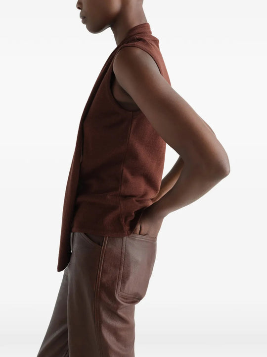 Brown top worn by a person, showing the top fit