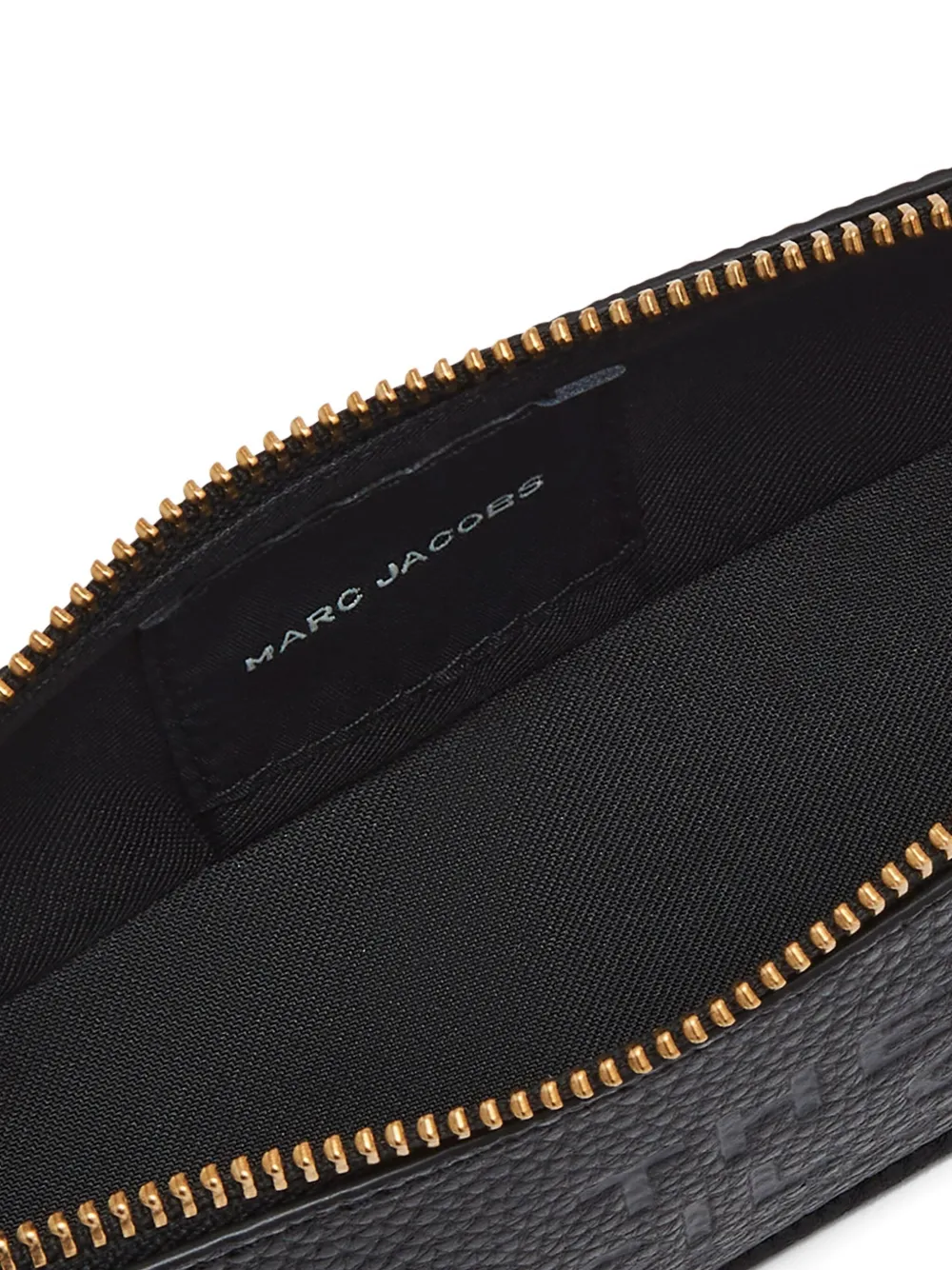 Close up of Black small accessories, showing texture of the Cow Split Leather  and Polyurethane Coating fabric