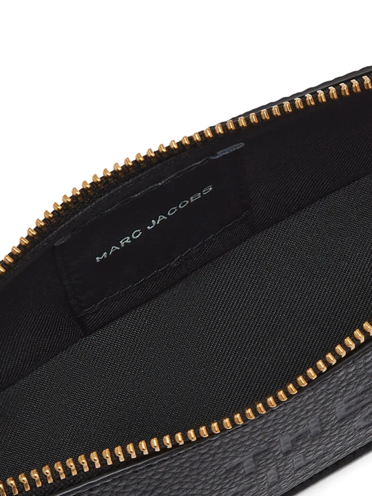 Close up of Black small accessories, showing texture of the Cow Split Leather  and Polyurethane Coating fabric
