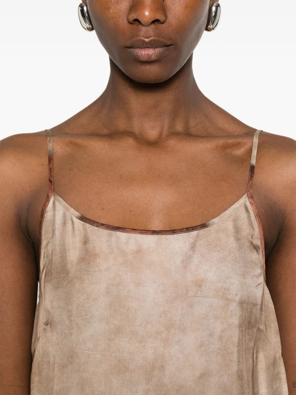 Close up of tan dress, showing texture of the Viscose fabric