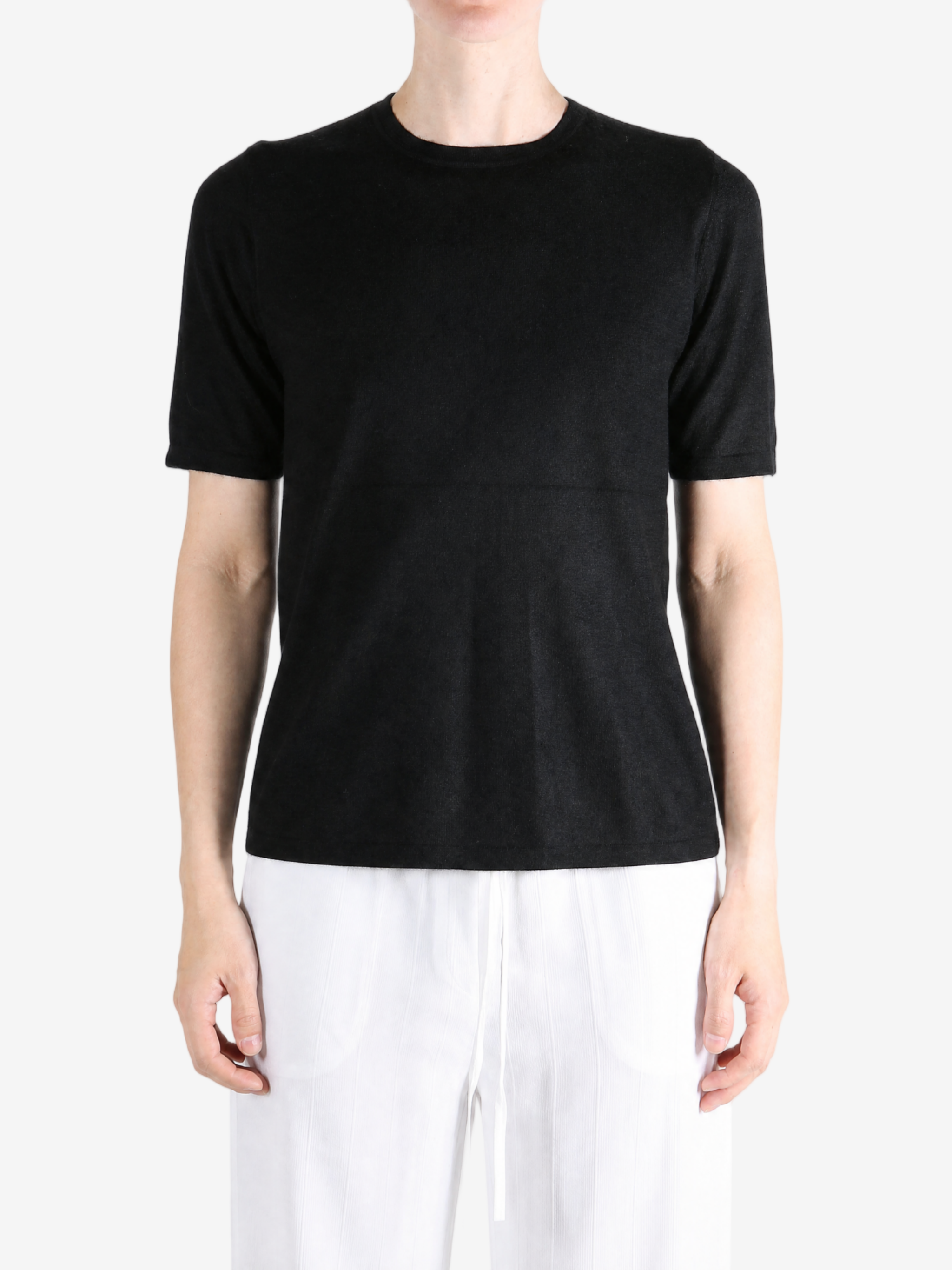 Black t-shirt worn by a person, showing the t-shirt fit