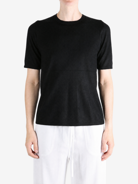 Black t-shirt worn by a person, showing the t-shirt fit