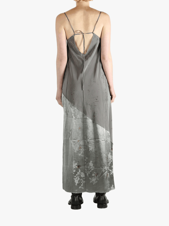 Grey dress worn by a person, showing the dress's fit