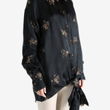 Black top worn by a person, showing the top's fit