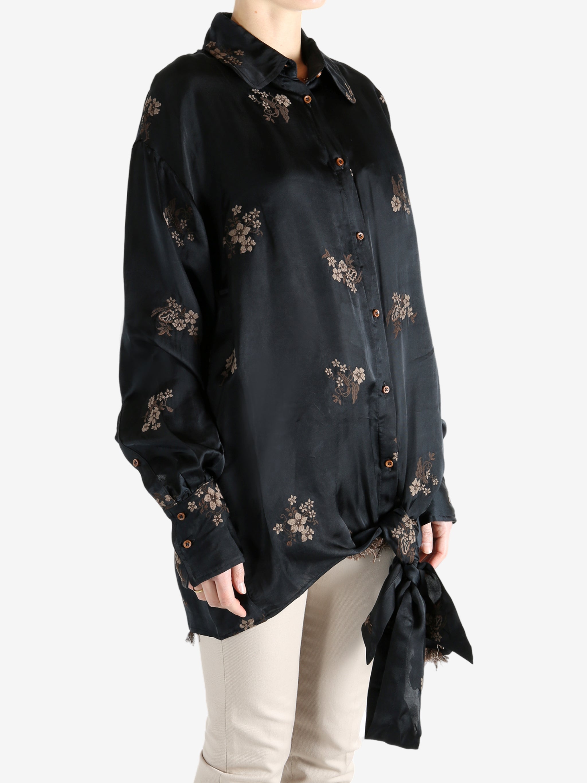 Black top worn by a person, showing the top's fit