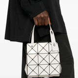 White bag worn by a person, showing the bag's fit