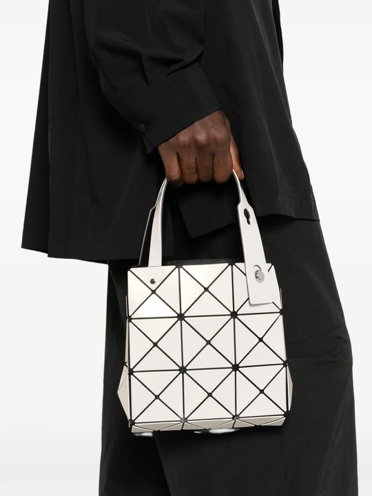 White bag worn by a person, showing the bag's fit