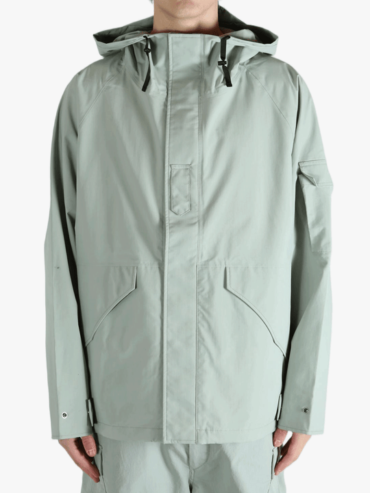 Grey jacket worn by a person, showing the jacket's fit