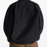 Black top worn by a person, showing the top's fit