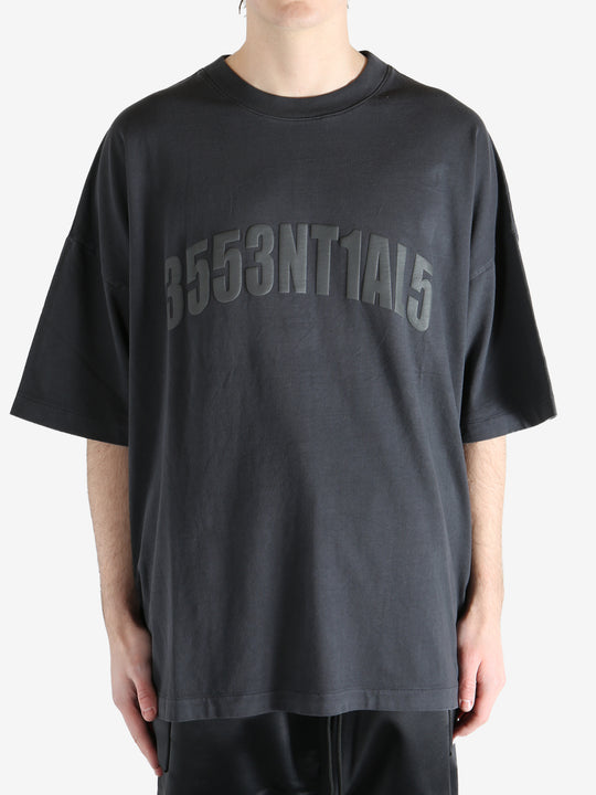 Black t-shirt worn by a person, showing the shirt's fit