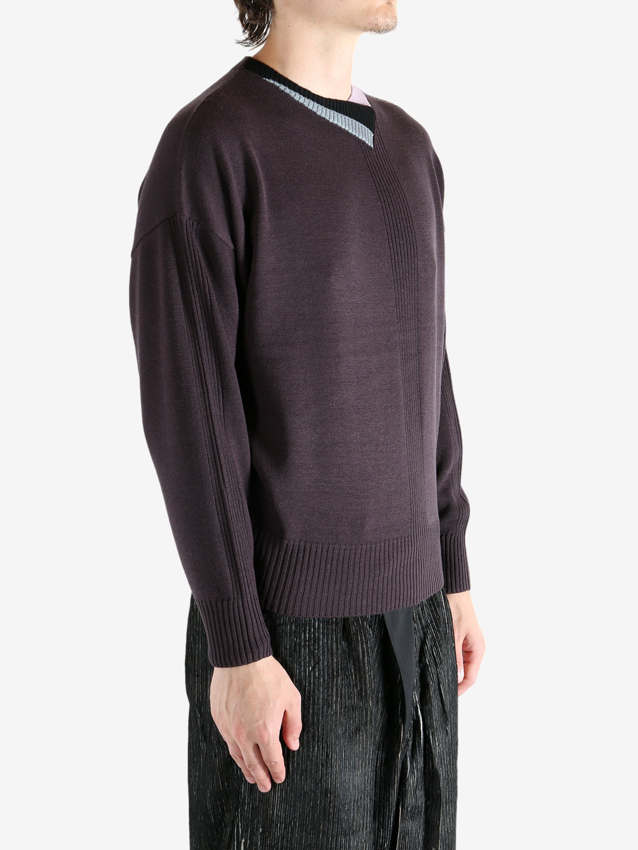 Brown top worn by a person, showing the top's fit