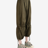 Green pants worn by a person, showing the pants fit