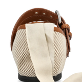 close up of brown flats, showing texture of the cotton fabric