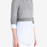 Grey top worn by a person, showing the top fit