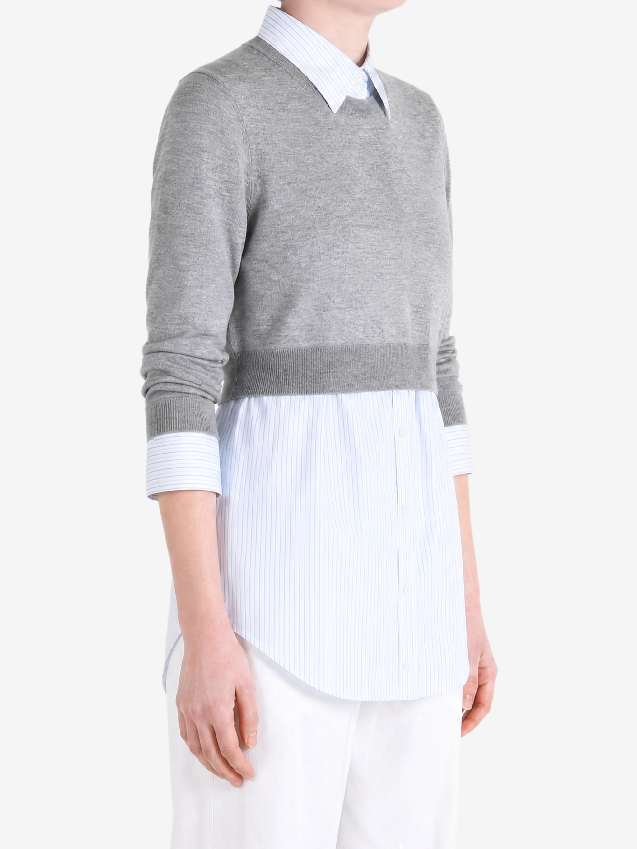 Grey top worn by a person, showing the top fit