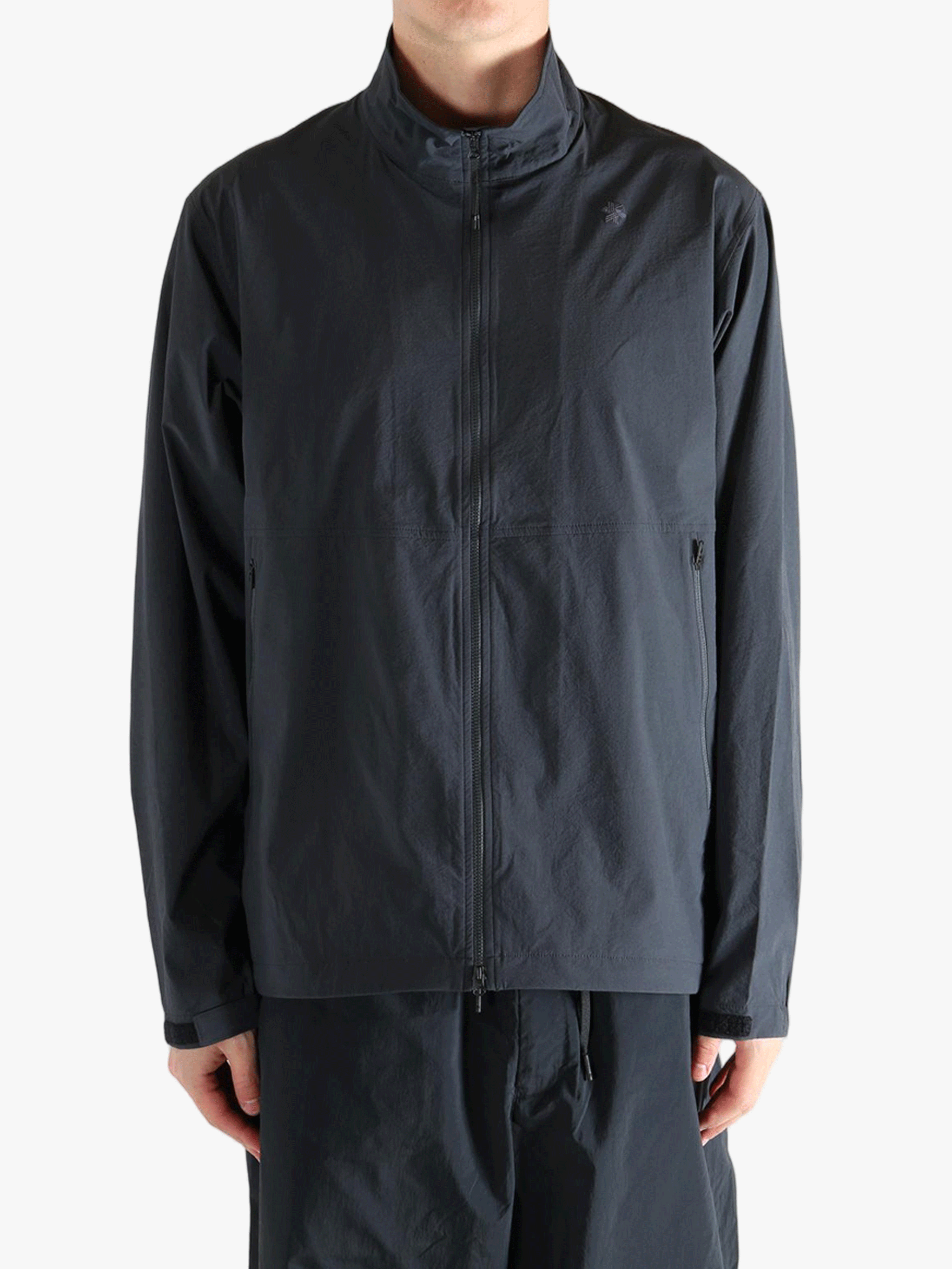 Gray jacket worn by a person, showing the jacket fit