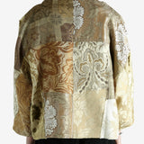 Tan jacket worn by a person, showing the jacket fit