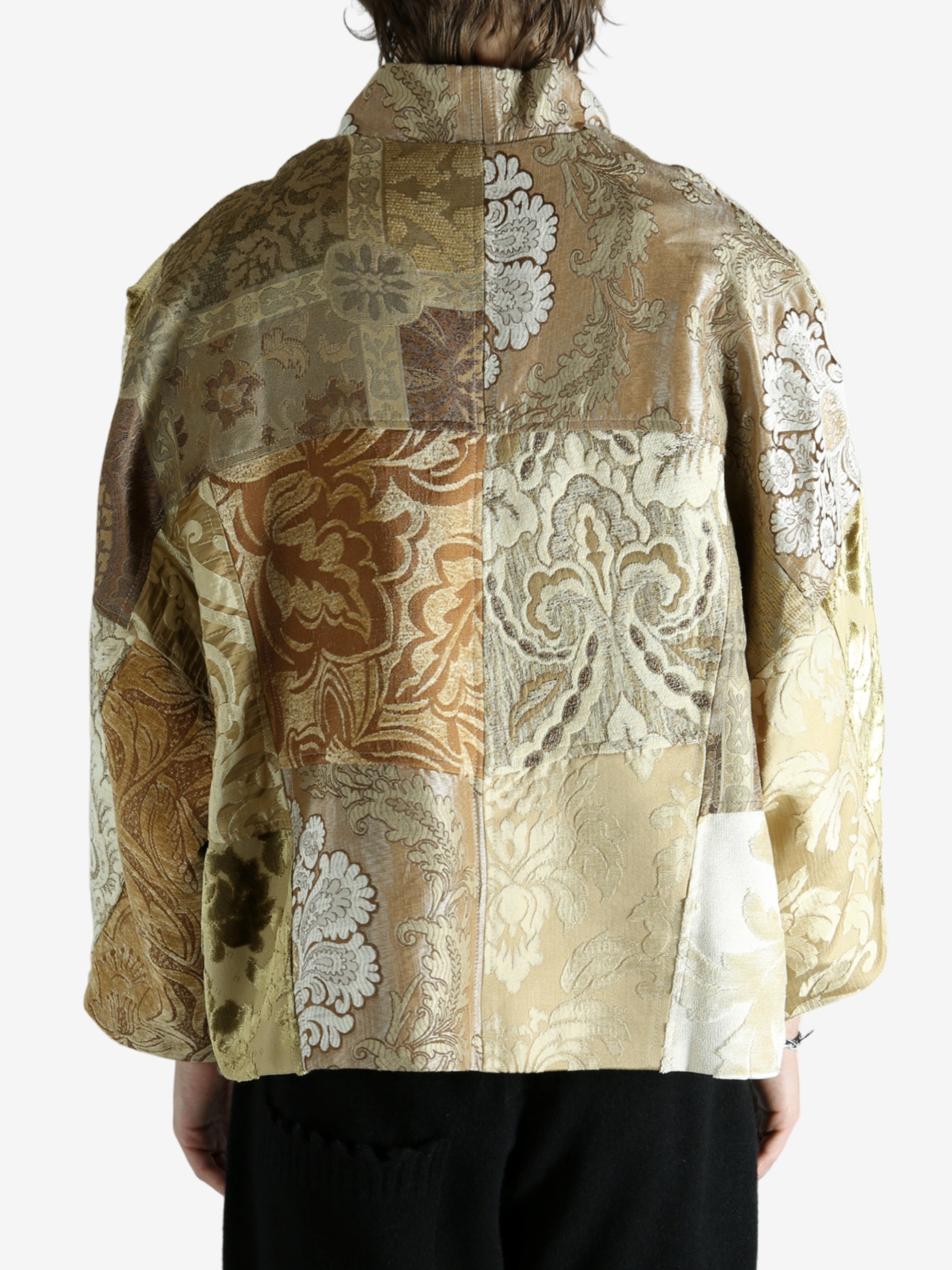 Tan jacket worn by a person, showing the jacket fit