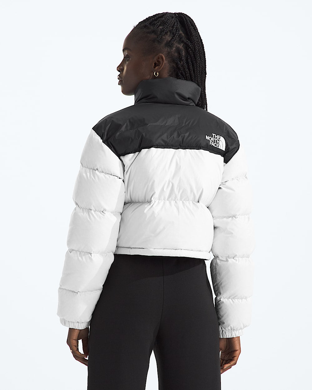 White jacket worn by a person, showing the jacket fit
