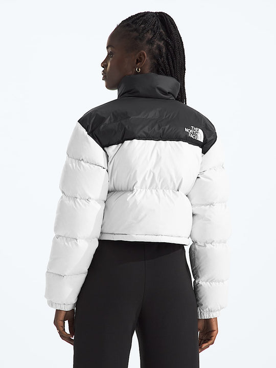 White jacket worn by a person, showing the jacket fit