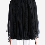 Black jacket worn by a person, showing the jacket fit