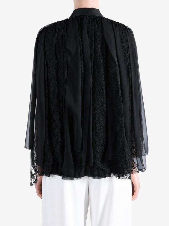 Black jacket worn by a person, showing the jacket fit