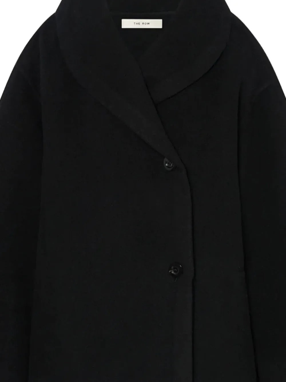 Close up of the black coat, showing texture of the wool fabric