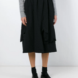 Black skirt worn by a person, showing the skirt fit