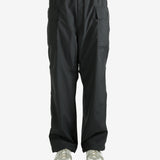 Black pants worn by a person, showing the pants's fit