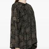 black tops worn by a person, showing the tops fit