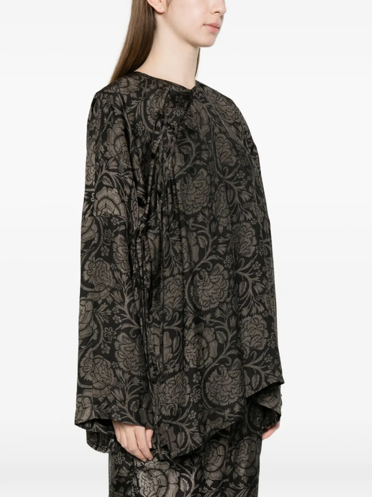 black tops worn by a person, showing the tops fit