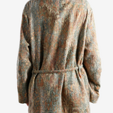 Orange jacket worn by a person, showing the jacket fit