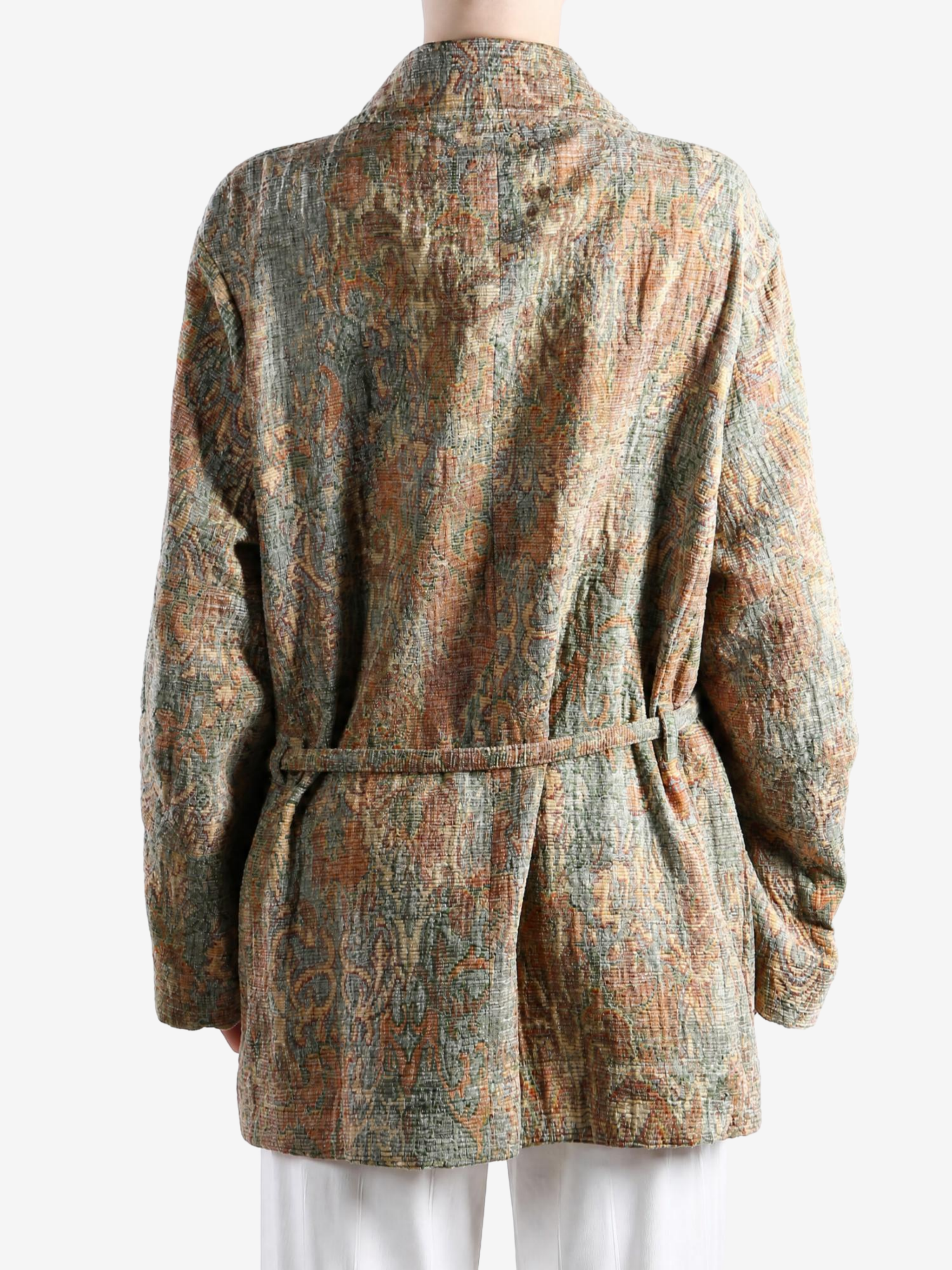 Orange jacket worn by a person, showing the jacket fit