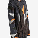 Brown top worn by a person, showing the top's fit