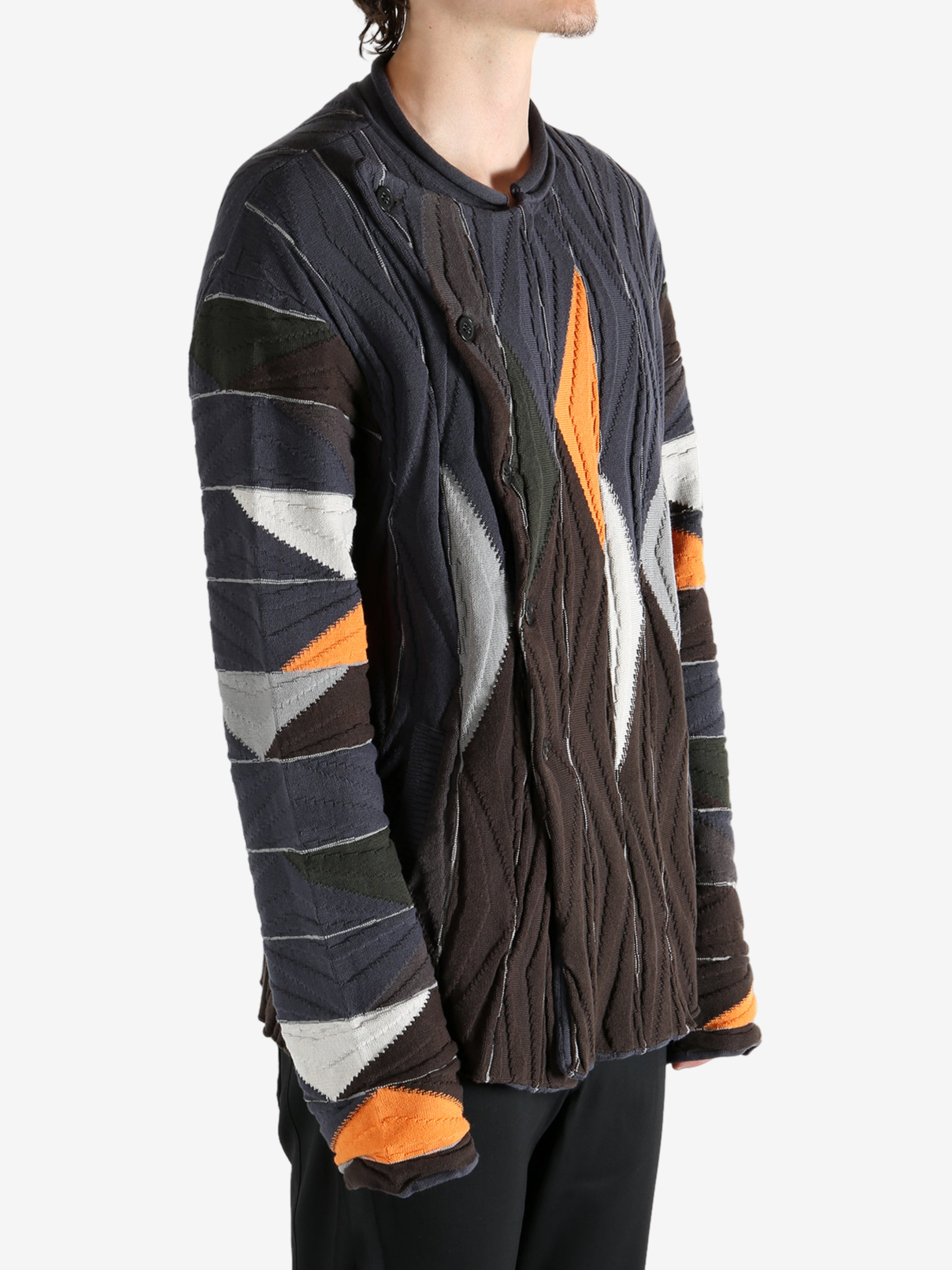 Brown top worn by a person, showing the top's fit