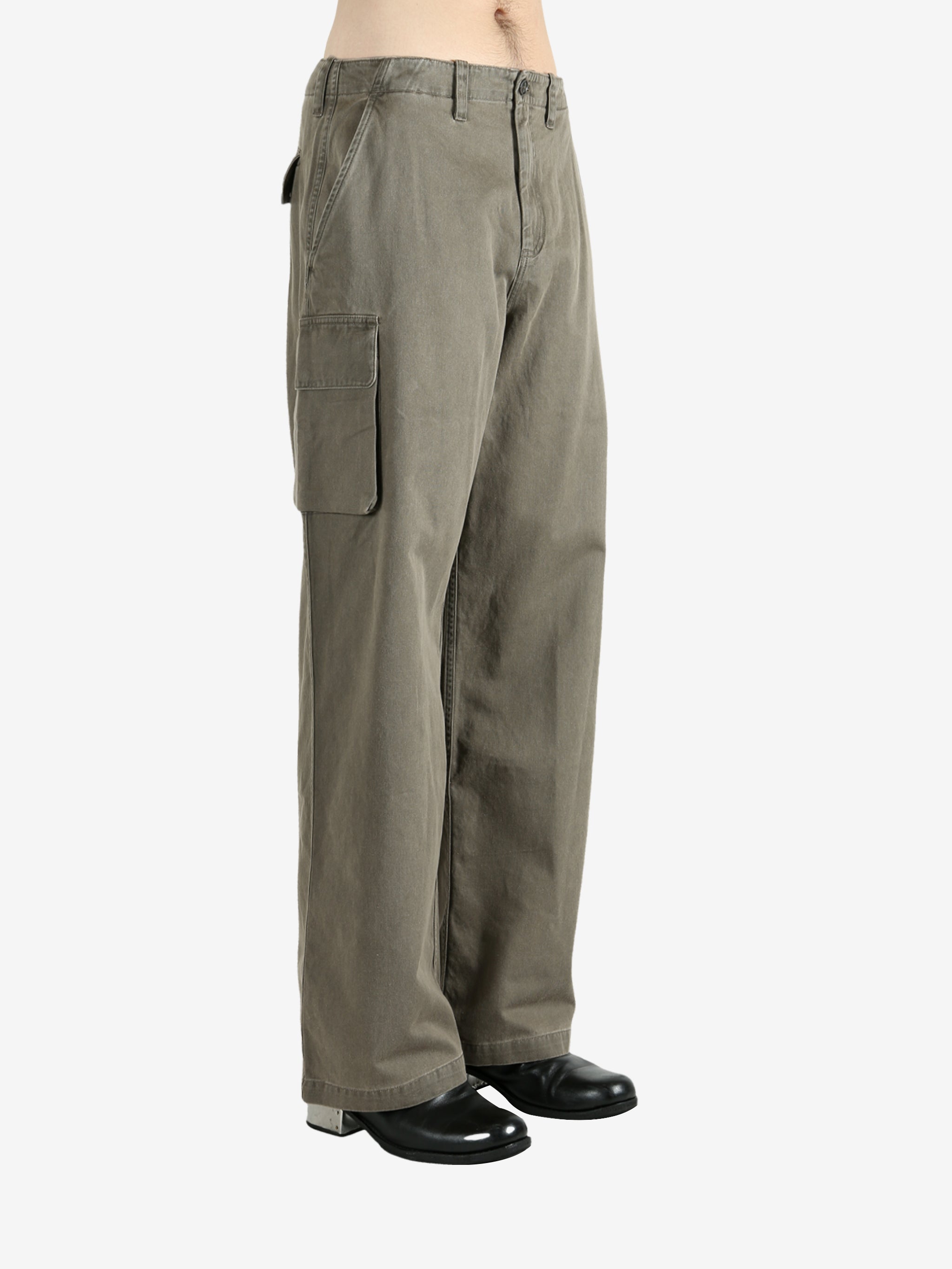 Tan pants worn by a person, showing the pants' fit