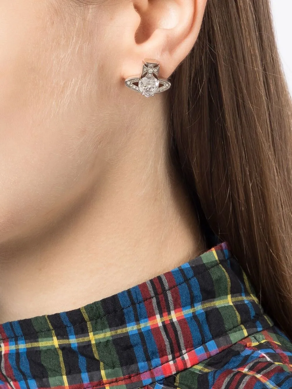 White jewerly worn by a person, showing the white jewerly's fit